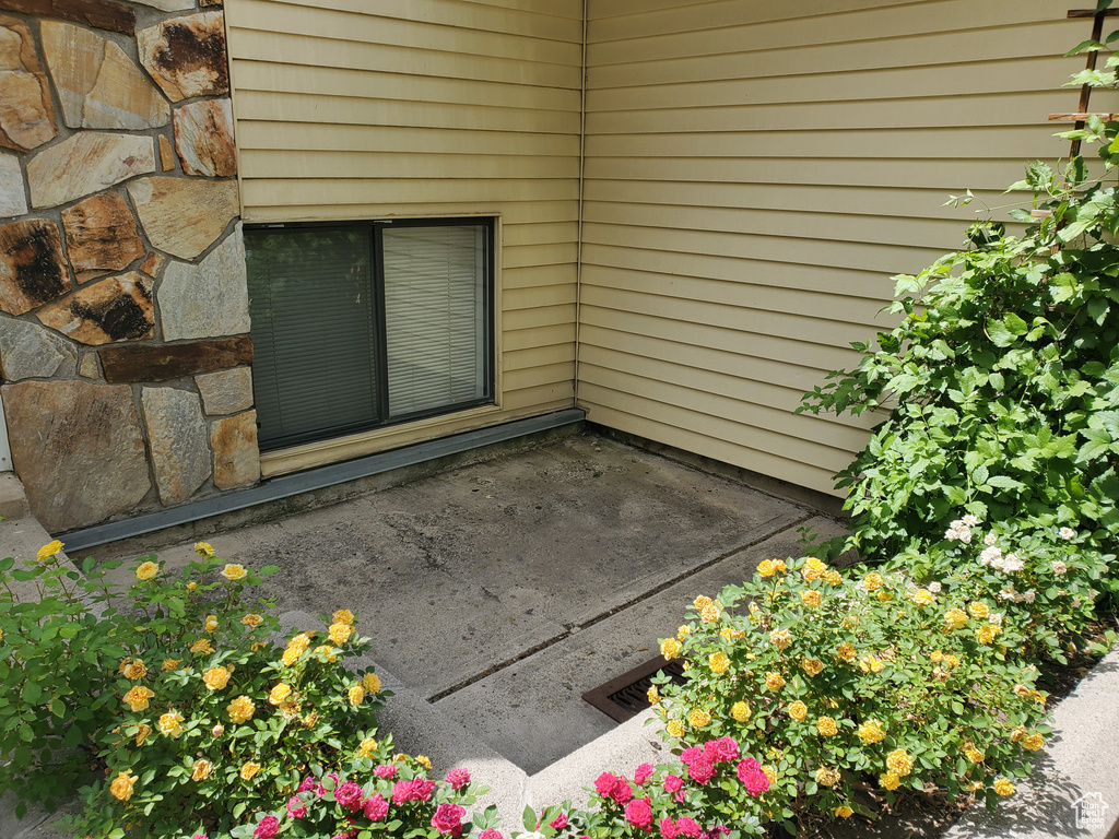 Entrance to property with stone siding