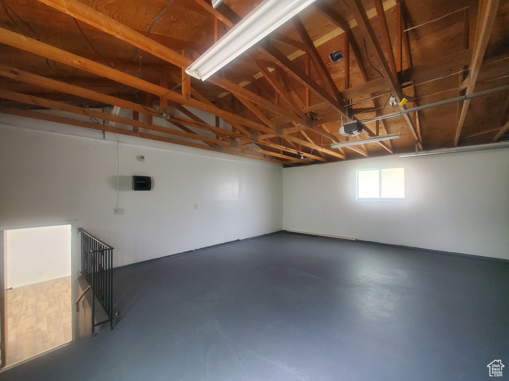 Garage featuring a garage door opener