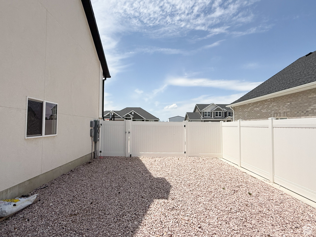View of yard featuring a gate