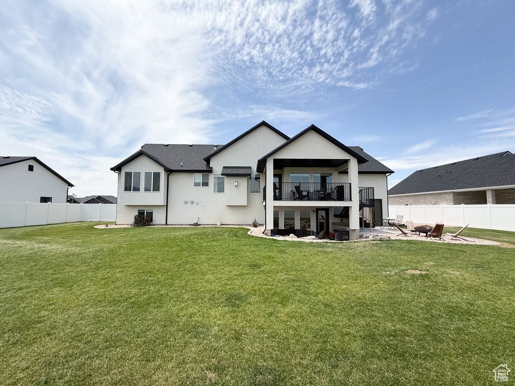 Back of house with a patio area, stucco siding, and stairway