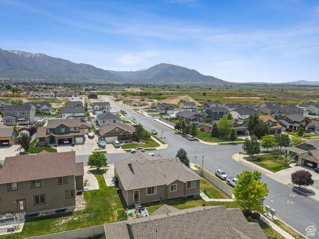 Aerial view of residential area featuring a mountain backdrop
