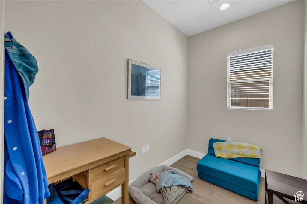 Office featuring wood finished floors and baseboards