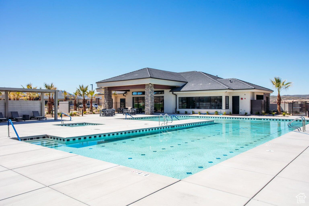 Community pool with a patio