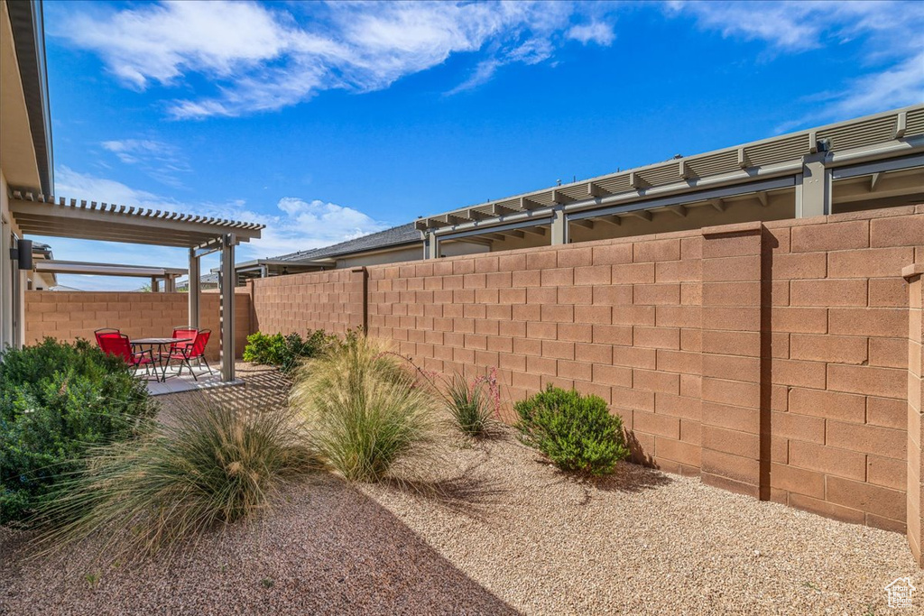 Fenced backyard featuring a patio area