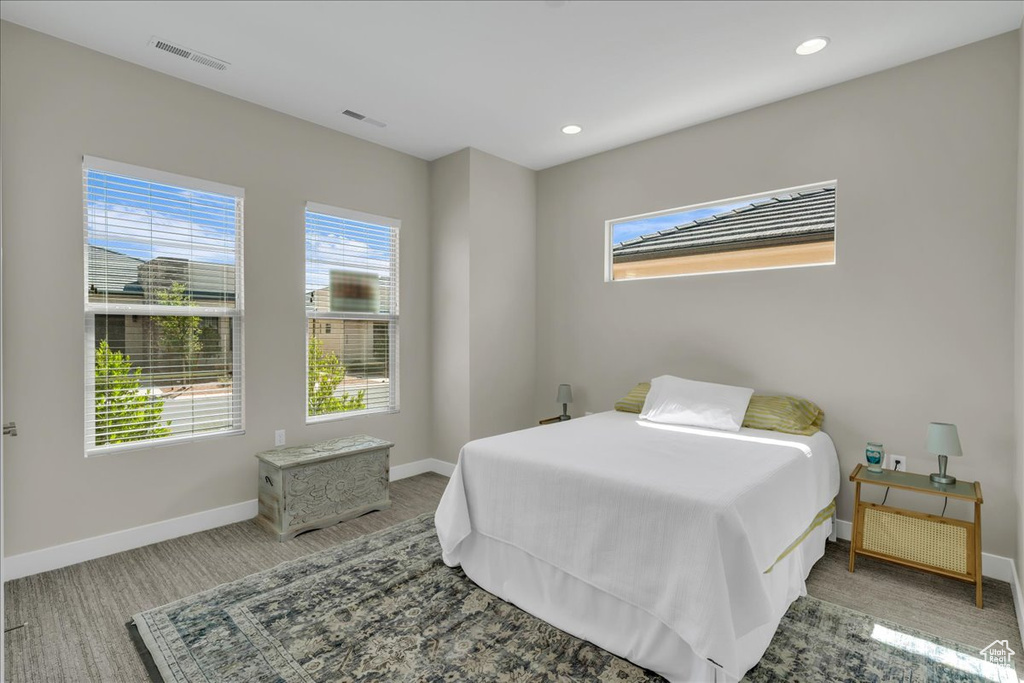 Bedroom featuring baseboards, carpet flooring, and recessed lighting