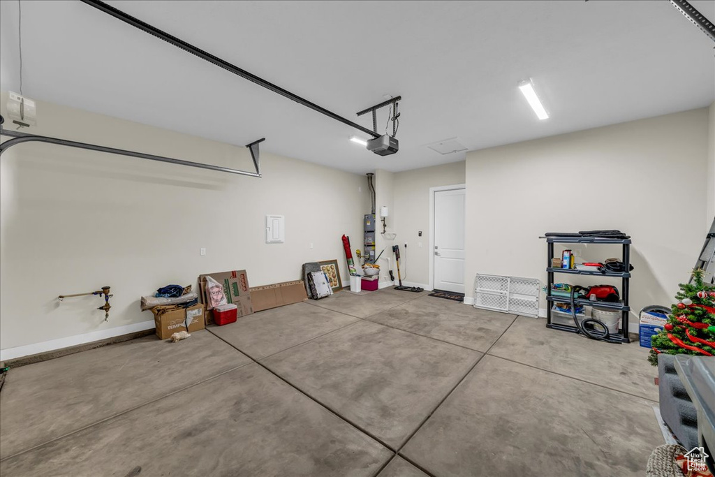 Garage featuring a garage door opener
