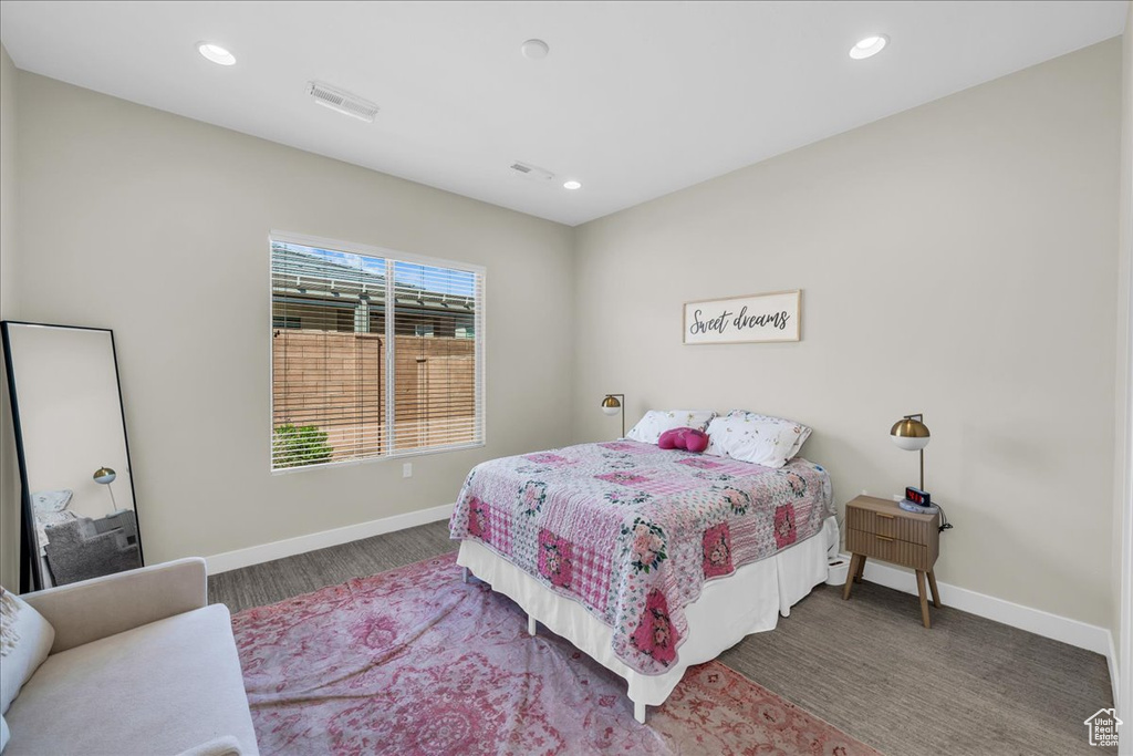 Bedroom with baseboards, recessed lighting, and wood finished floors