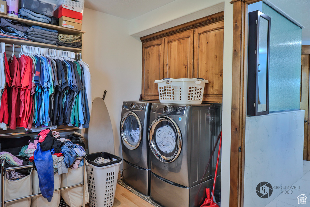 Washroom with separate washer and dryer and cabinet space