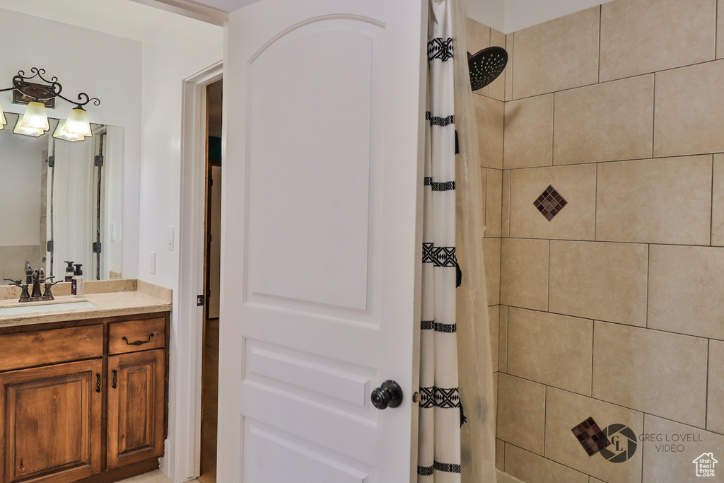 Bathroom with vanity and a shower with curtain
