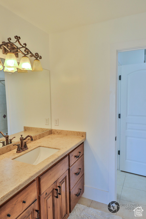 Bathroom featuring vanity and tile patterned floors