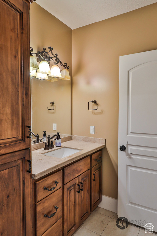 Bathroom featuring vanity and tile patterned flooring