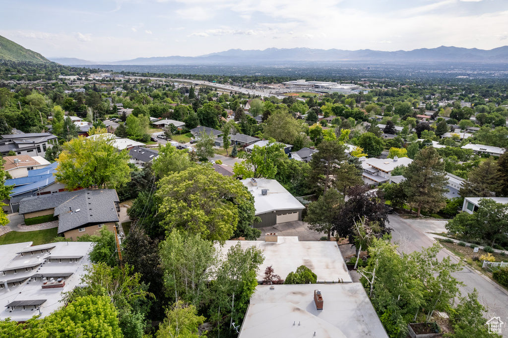 Aerial view of residential area featuring a mountainous background