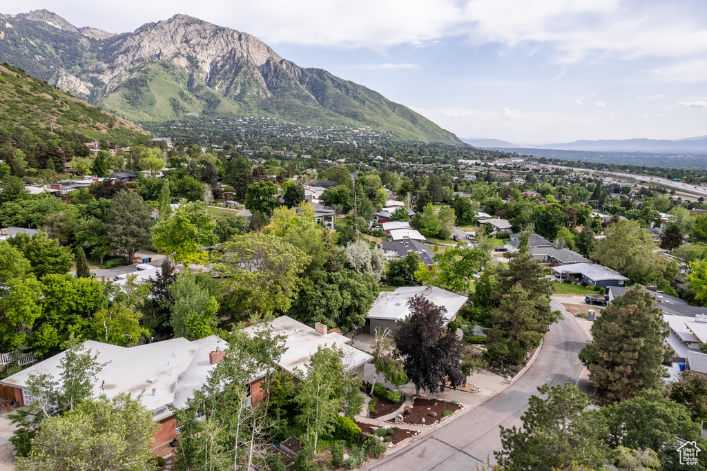Aerial view of property\'s location featuring a mountainous background and nearby suburban area
