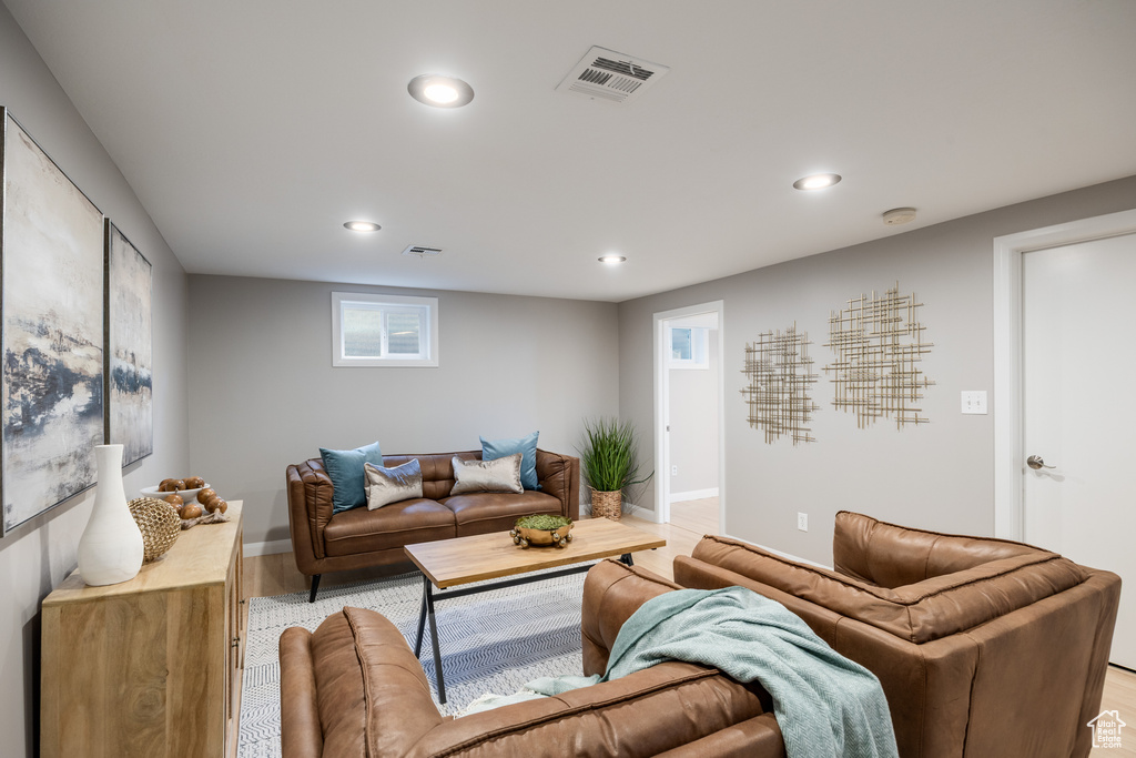 Living area featuring recessed lighting, light wood-type flooring, and baseboards