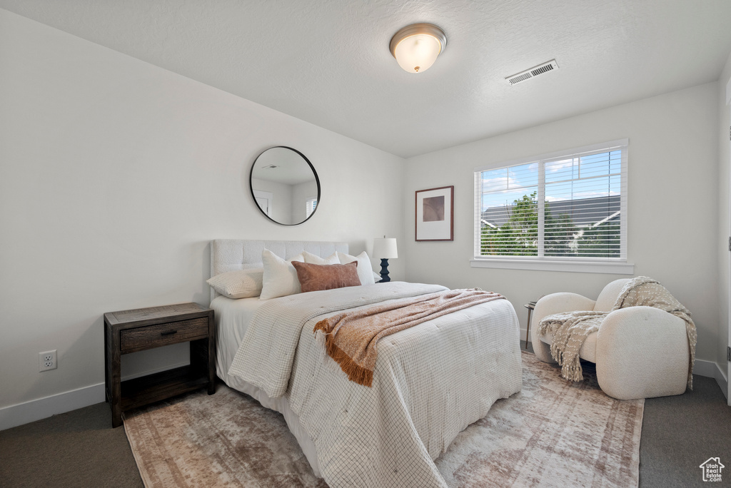 Bedroom with carpet and baseboards