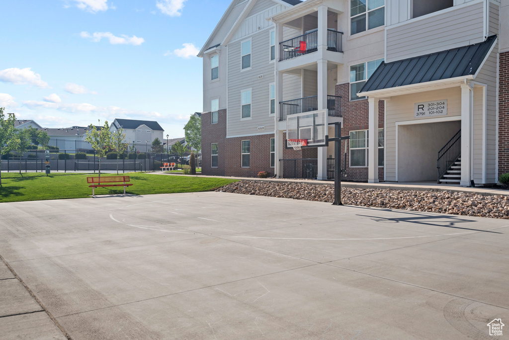 View of basketball court featuring community basketball court and a residential view