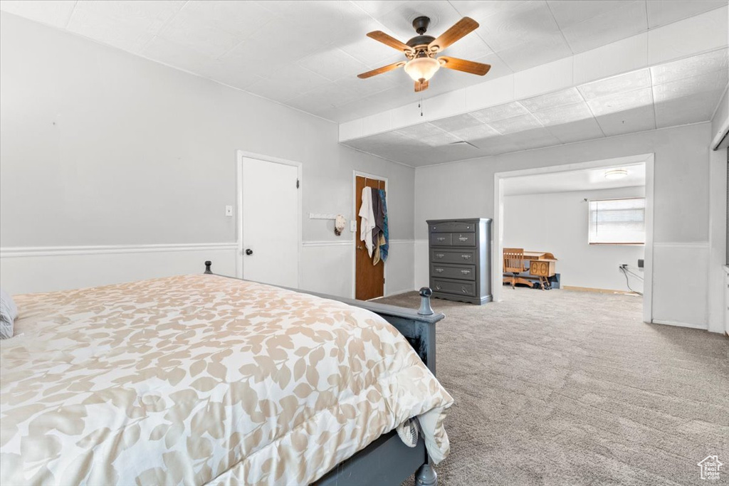 Bedroom featuring carpet floors and ceiling fan