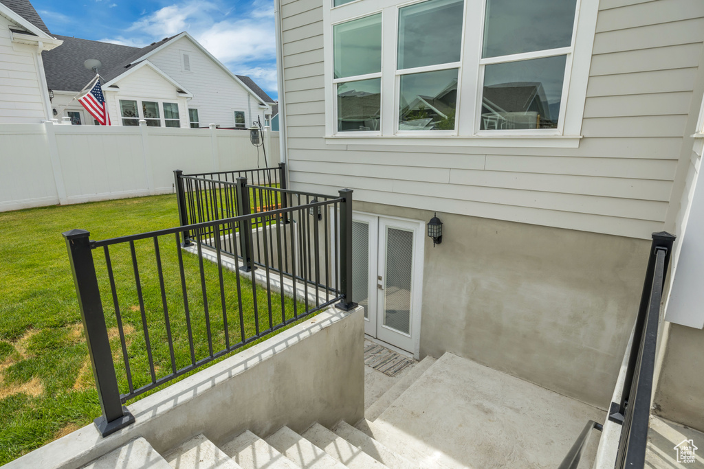 View of patio with a balcony