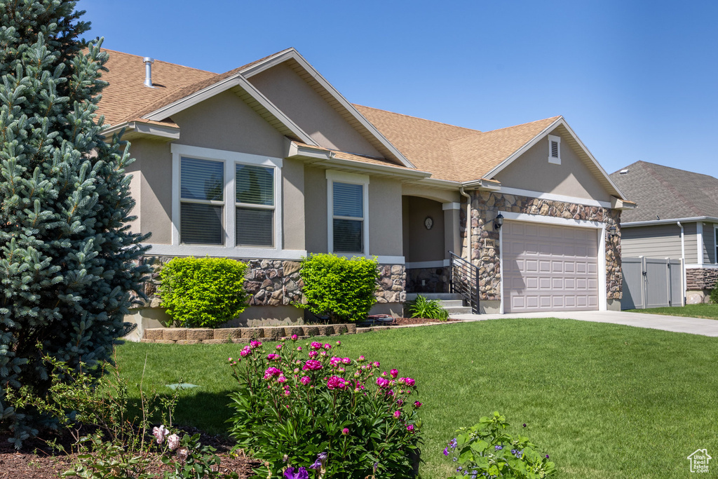View of front of house with stone siding, stucco siding, a garage, concrete driveway, and roof with shingles