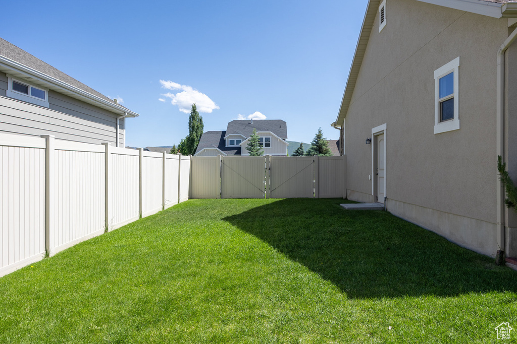 View of yard with a gate