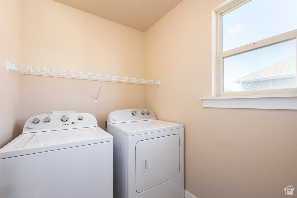 Laundry room featuring washer and clothes dryer