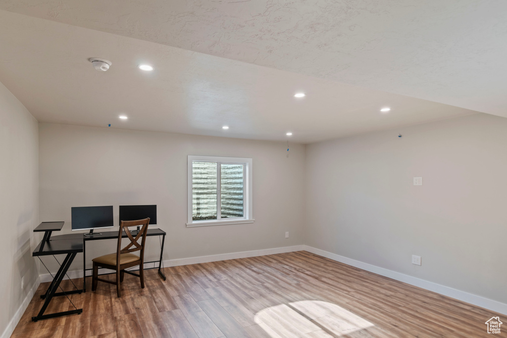 Office with wood finished floors, recessed lighting, and baseboards