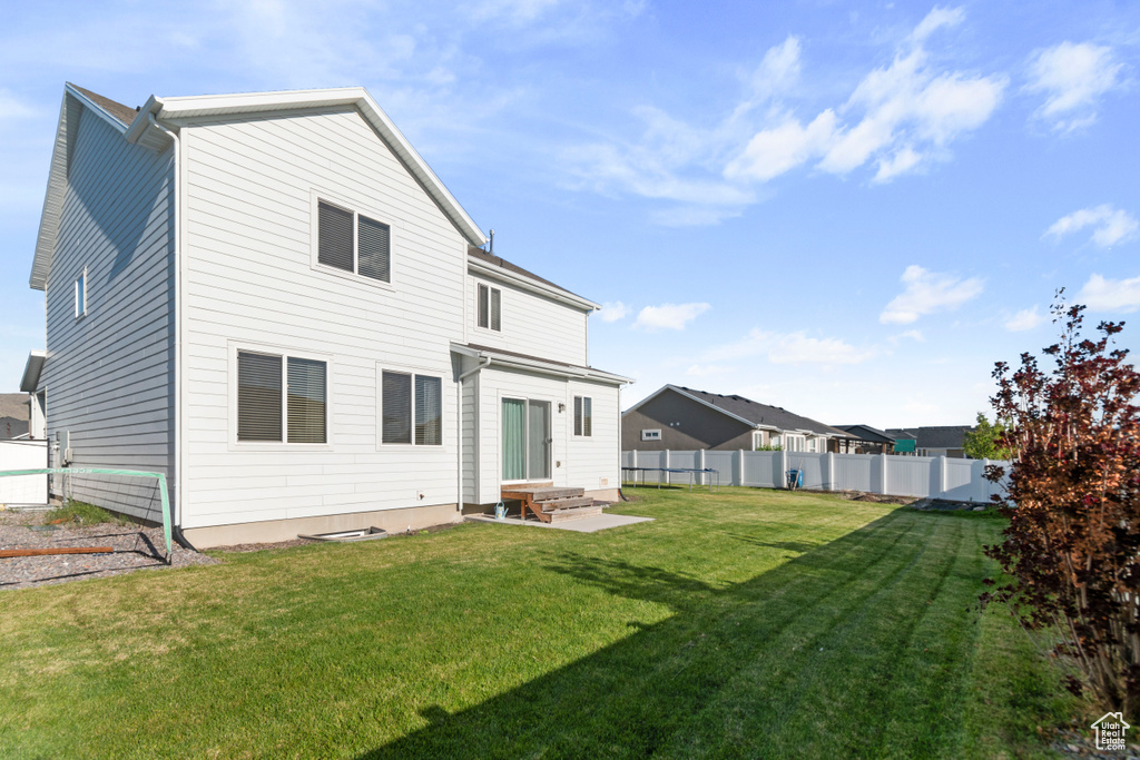 Rear view of property featuring entry steps