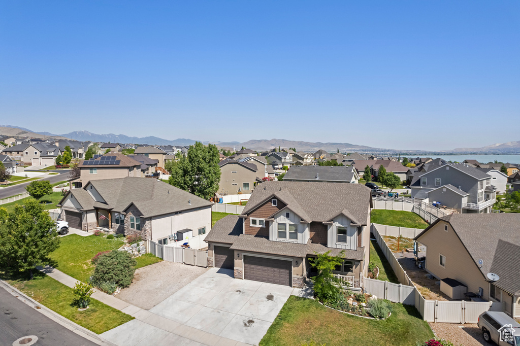 Aerial perspective of suburban area featuring a mountainous background