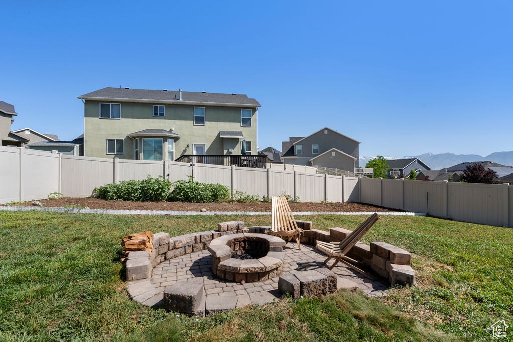 View of yard featuring an outdoor fire pit and a patio area