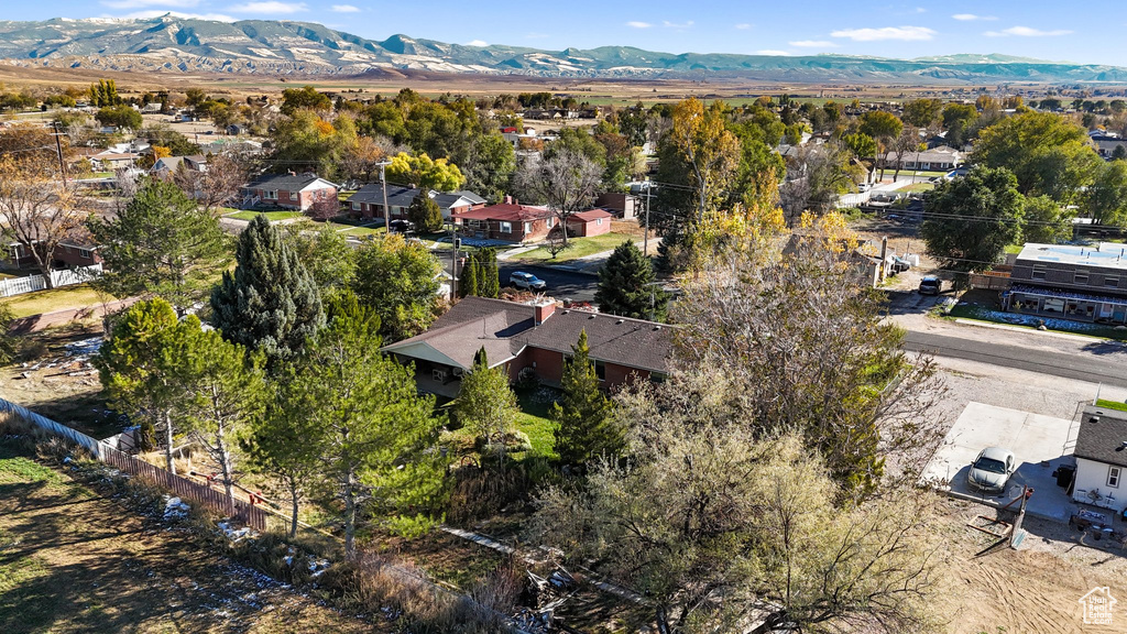 Aerial view of residential area featuring a mountainous background