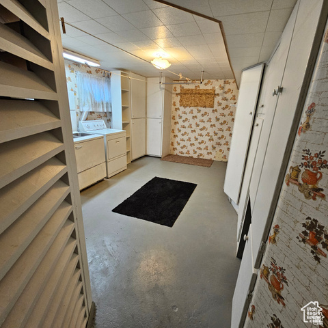 Basement featuring washer and clothes dryer