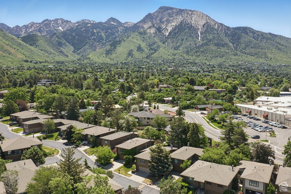 View of mountain backdrop featuring nearby suburban area