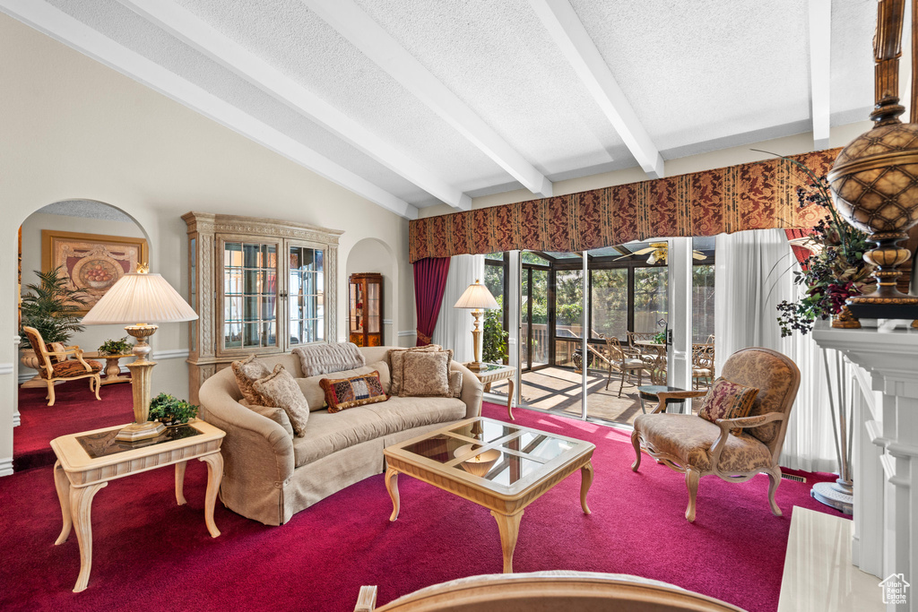 Living area featuring a textured ceiling and carpet