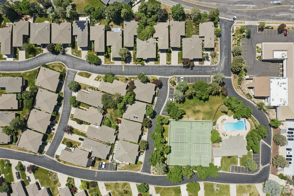 View of property location with a pool area and nearby suburban area