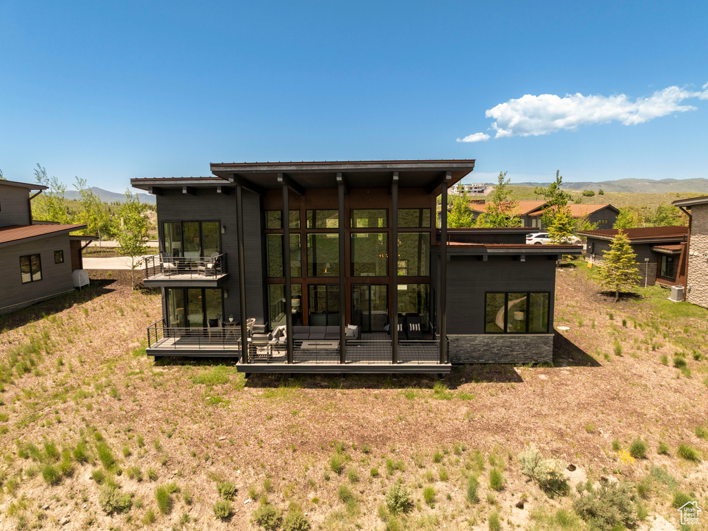 Back of property featuring a mountain view