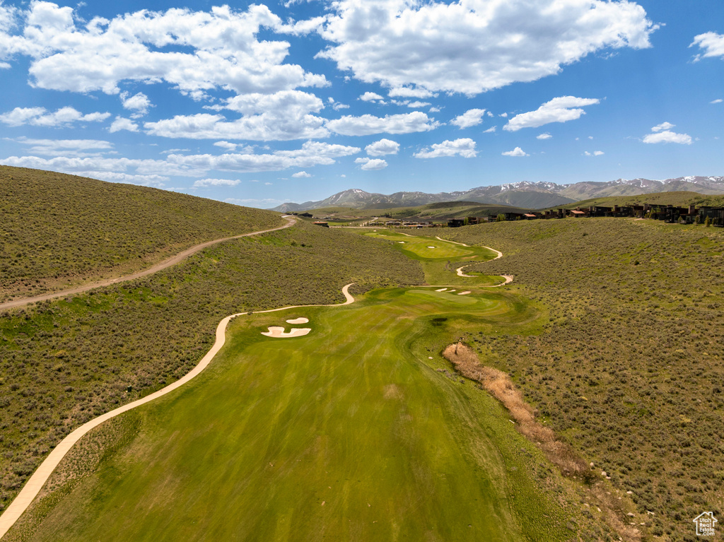 Bird's eye view of a mountain backdrop and a golf course