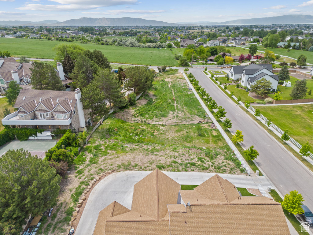 Aerial view of residential area featuring a mountainous background