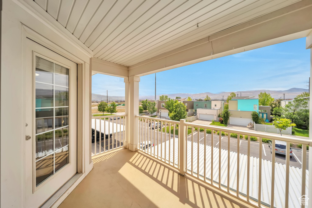 Balcony featuring a mountain view and a residential view