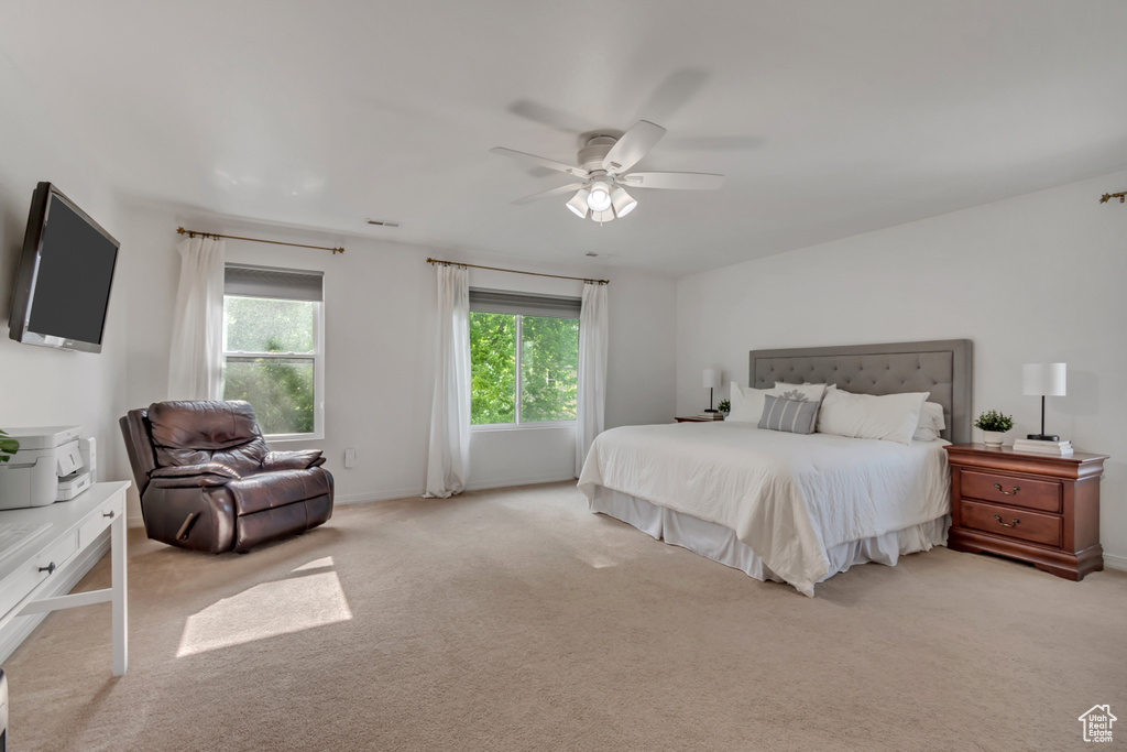 Bedroom featuring carpet floors, ceiling fan, and baseboards