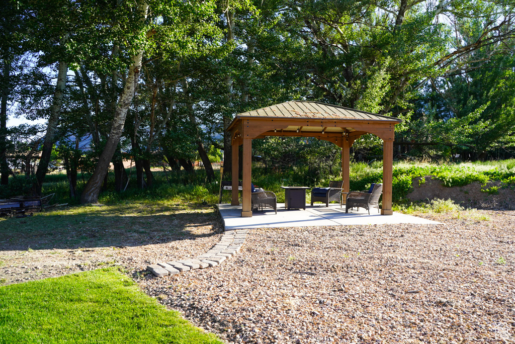 Surrounding community featuring a gazebo and a patio area