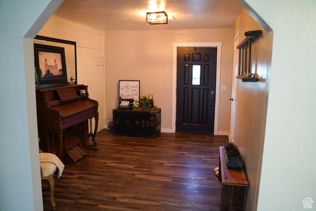 Foyer entrance with wood finished floors