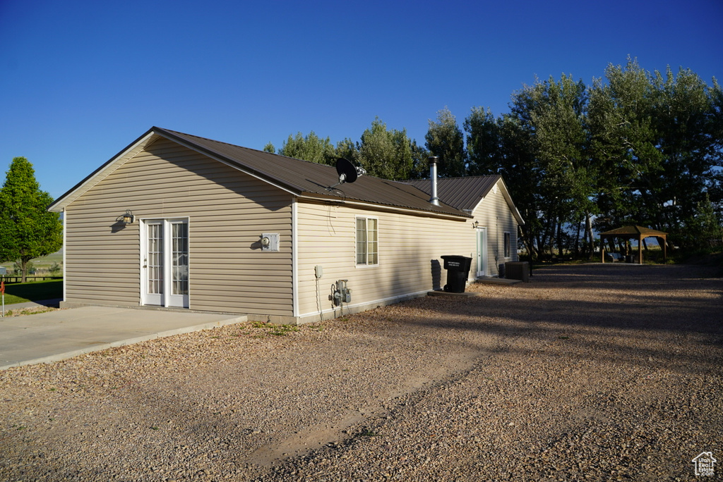 View of property exterior with a gazebo