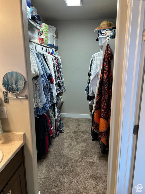Spacious closet featuring carpet flooring