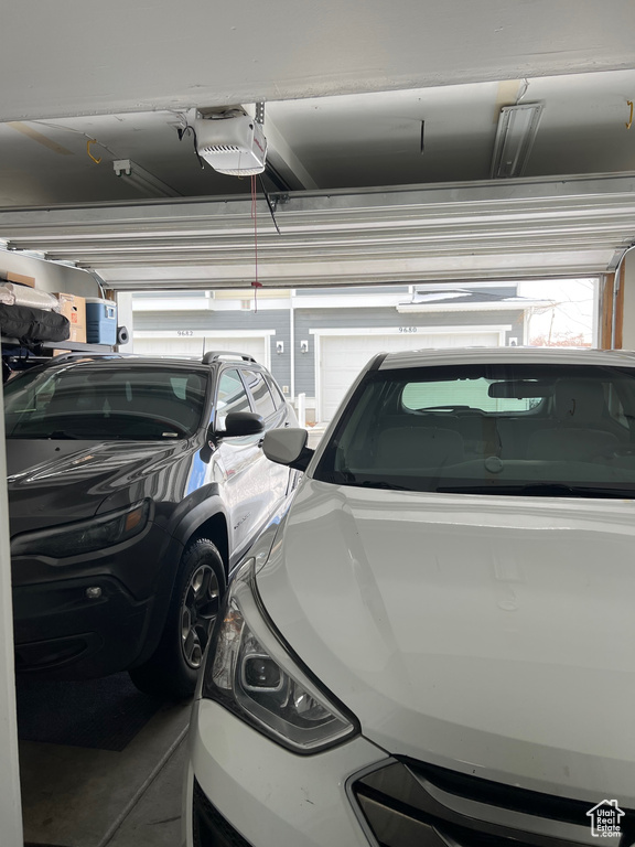Garage featuring a garage door opener