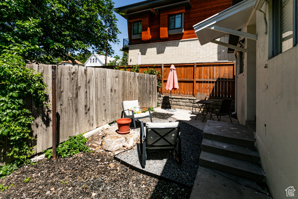 Fenced backyard with a patio