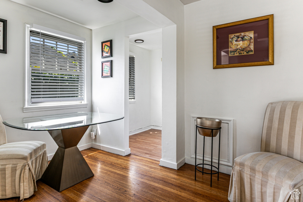 Sitting room with wood finished floors and baseboards
