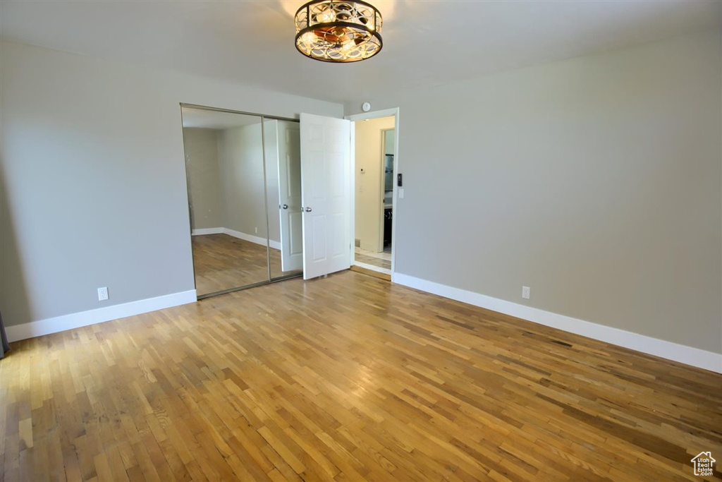 Spare room with light wood-type flooring and baseboards