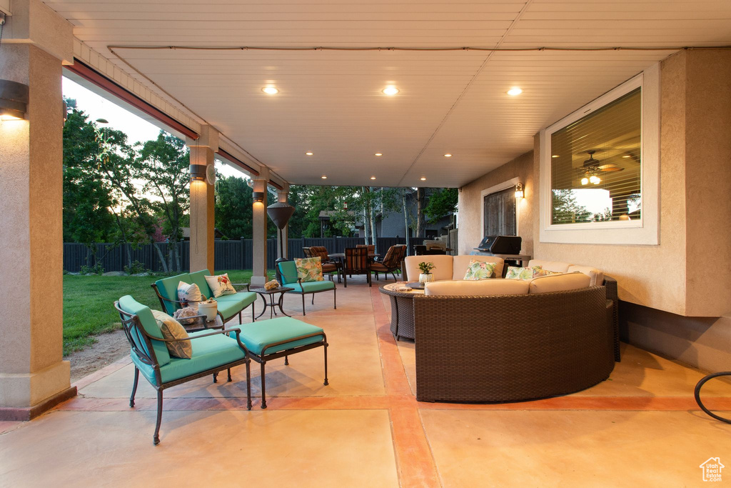 Fenced backyard with an outdoor living space, a patio, and outdoor dining area