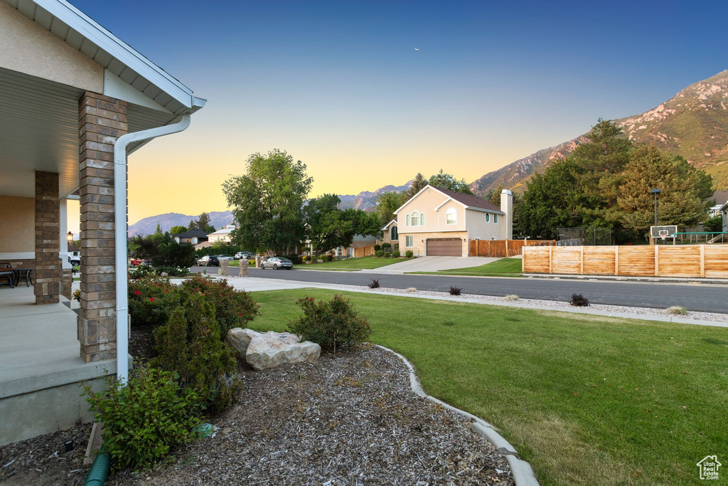 Yard at dusk with a mountain view