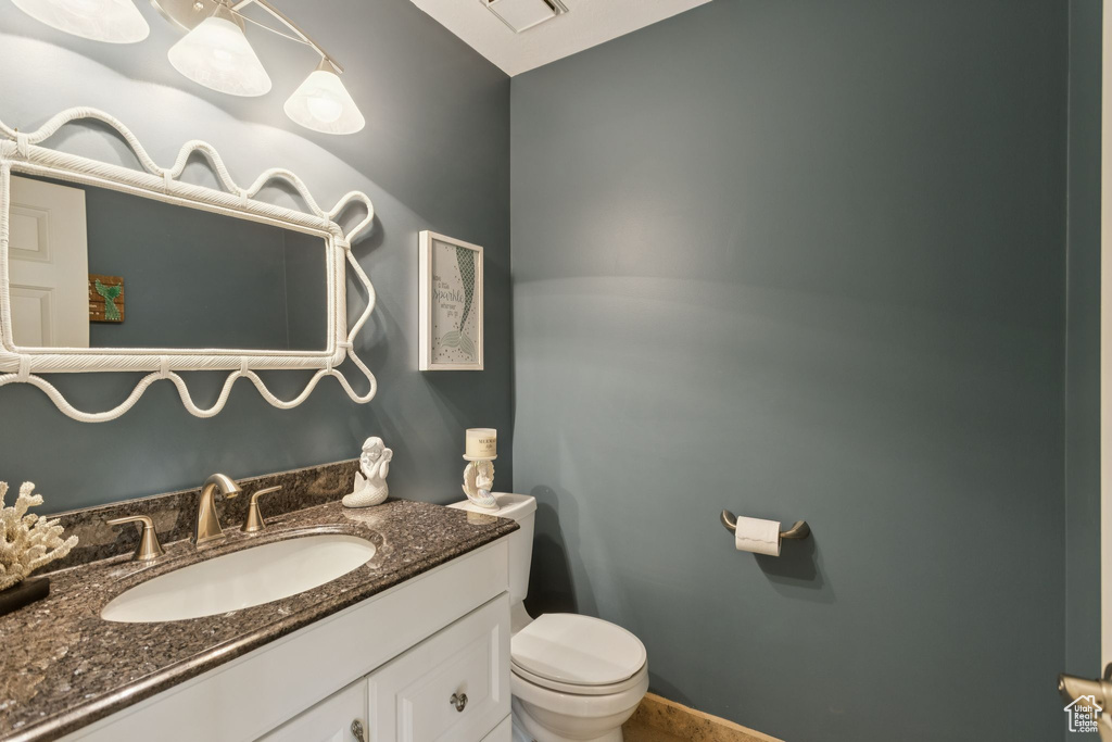 Bathroom with toilet and vanity